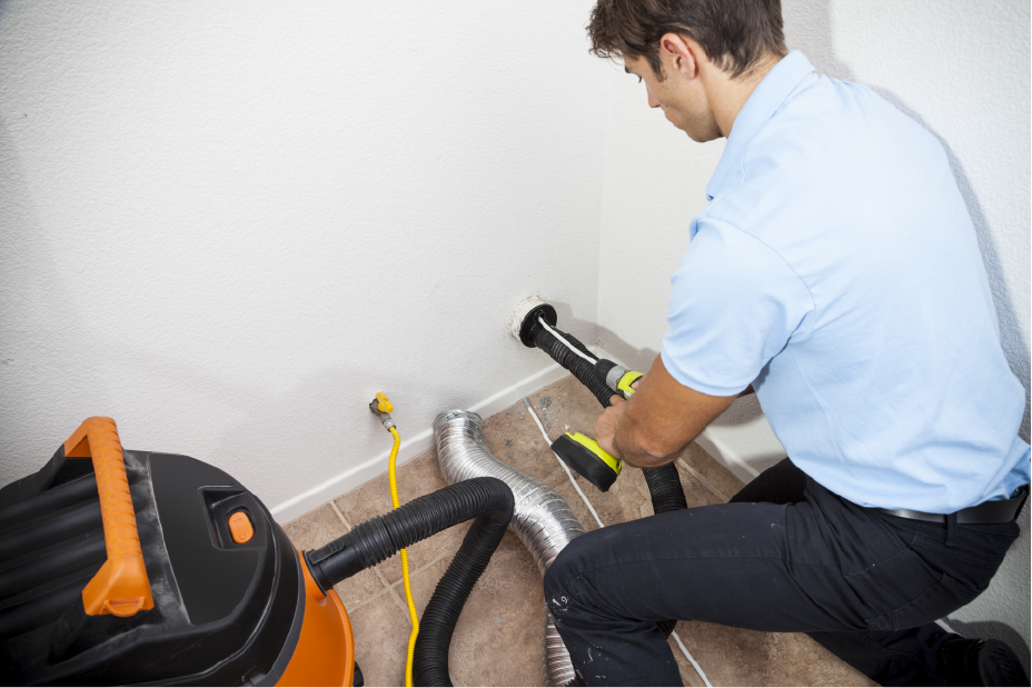 Technician cleaning vent | Pro Comfort Heating & Cooling