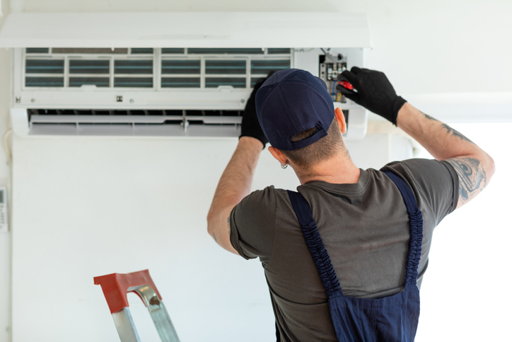 Technician repairing Ductless air conditioner | Pro Comfort Heating & Cooling