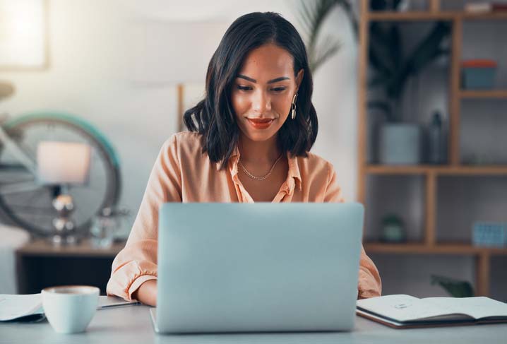 Woman in front of a computer | Pro Comfort Heating & Cooling